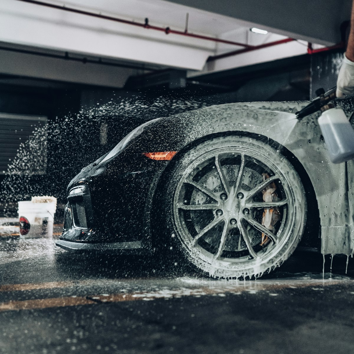 Car being washed with soap foam